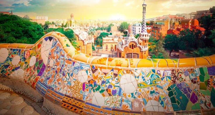 Colorful mosaic tiles at Park Güell Barcelona with Gaudà architecture, Mediterranean cityscape and artistic ceramic bench design