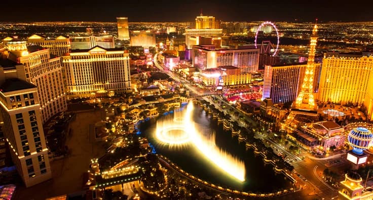 Spectacular aerial night view of Las Vegas Strip with illuminated casinos, Bellagio fountains and luxury hotel resorts