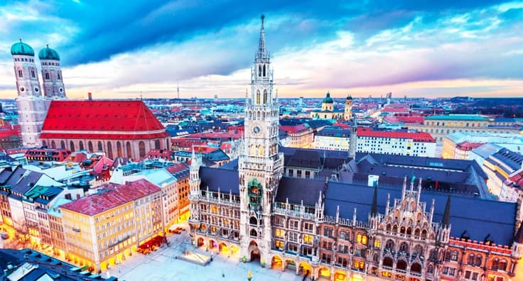 Beautiful aerial view of Munich city center with historic Marienplatz, red-roofed buildings, Gothic towers and Bavarian architecture